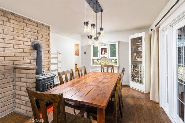 Dining room, Fireplace, Interior, Pendant Lights, Stone Walls, Wood Texture Flooring