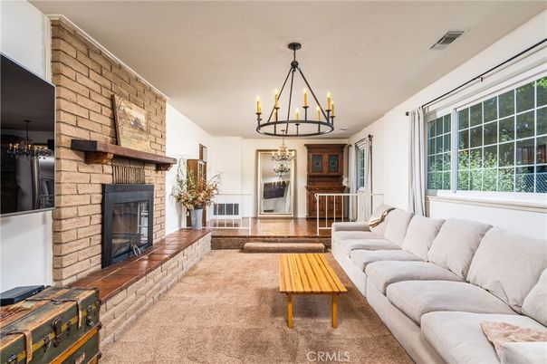 Chandelier, Fireplace, Interior, Living room, Stone Walls