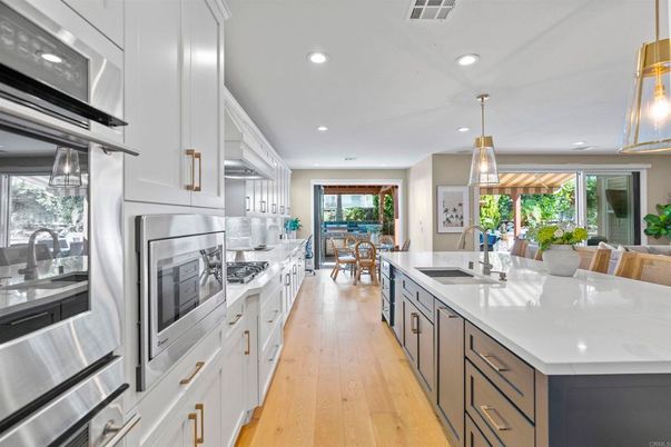 Dining room, Interior, Kitchen, Pendant Lights, Recessed Lighting, Stainless Steel Appliances, Wood Texture Flooring