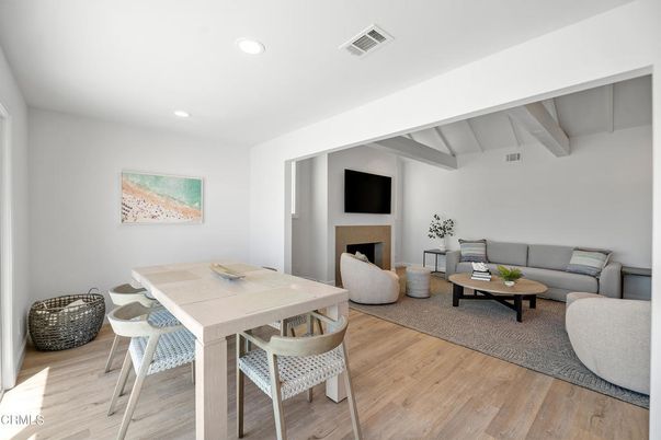 Dining room, Fireplace, Interior, Living room, Recessed Lighting, Wood Texture Flooring
