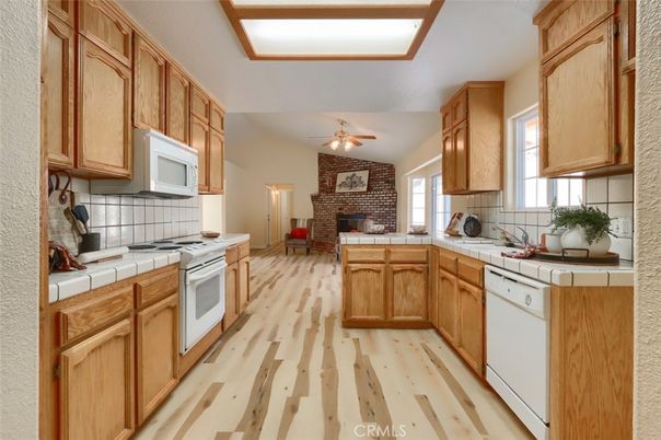 Fireplace, Interior, Kitchen, Stone Walls, Tile Countertops, Wood Texture Flooring