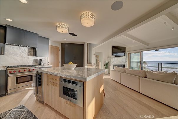 Fireplace, Interior, Kitchen, Living room, Recessed Lighting, Stainless Steel Appliances, Water, Wood Texture Flooring