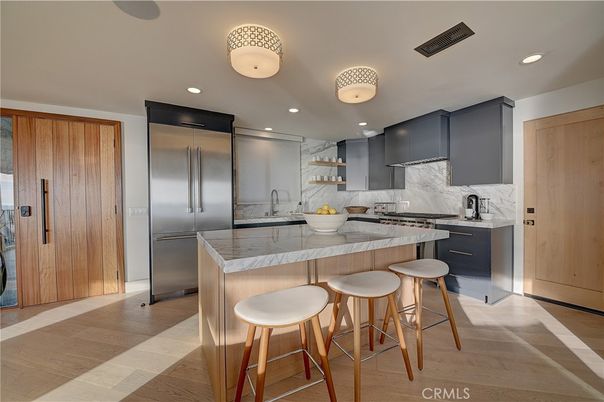 Interior, Kitchen, Marble Walls, Recessed Lighting, Stainless Steel Appliances, Wood Texture Flooring