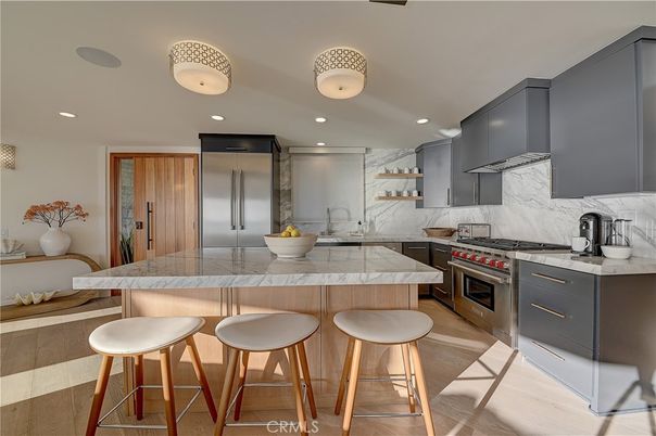 Interior, Kitchen, Marble Walls, Recessed Lighting, Stainless Steel Appliances, Wood Texture Flooring