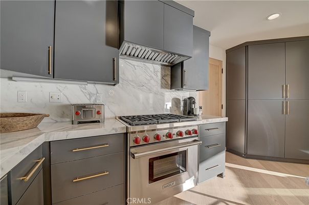 Interior, Kitchen, Marble Walls, Recessed Lighting, Stainless Steel Appliances, Wood Texture Flooring