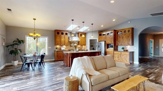 Chandelier, Dining room, Interior, Kitchen, Living room, Pendant Lights, Recessed Lighting, Stainless Steel Appliances, Wood Texture Flooring