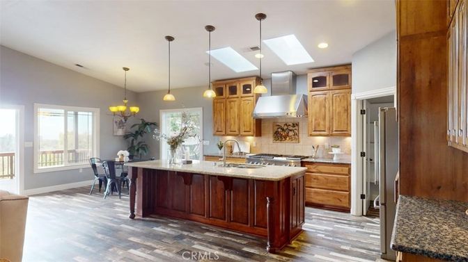 Chandelier, Dining room, Interior, Kitchen, Pendant Lights, Recessed Lighting, Stainless Steel Appliances, Wood Texture Flooring