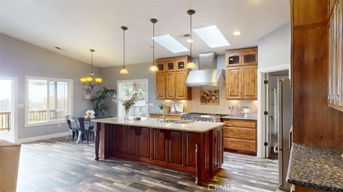 Chandelier, Dining room, Interior, Kitchen, Pendant Lights, Recessed Lighting, Stainless Steel Appliances, Wood Texture Flooring