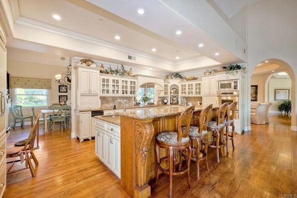 Chandelier, Dining room, Interior, Kitchen, Recessed Lighting, Stainless Steel Appliances, Wood Texture Flooring