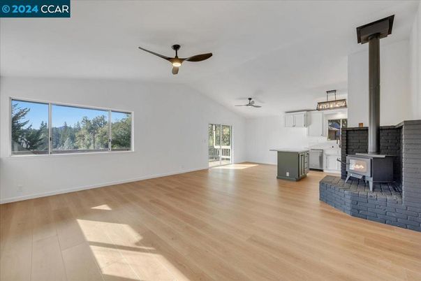 Empty room, Fireplace, Interior, Kitchen, Pendant Lights, Wood Texture Flooring