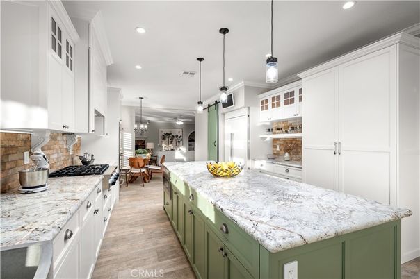 Chandelier, Dining room, Interior, Kitchen, Pendant Lights, Recessed Lighting, Stainless Steel Appliances, Wood Texture Flooring