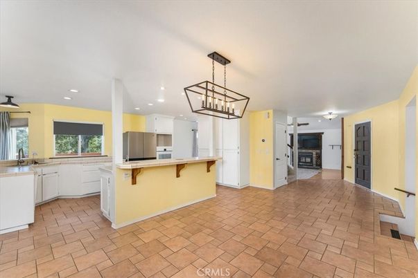 Chandelier, Fireplace, Interior, Kitchen, Pendant Lights, Recessed Lighting, Stainless Steel Appliances