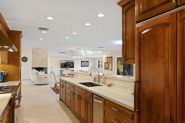 Chandelier, Dining room, Fireplace, Interior, Kitchen, Living room, Pendant Lights, Recessed Lighting, Stainless Steel Appliances