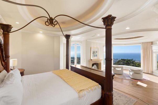 Bedroom, Fireplace, Interior, Recessed Lighting, Water, Wood Texture Flooring