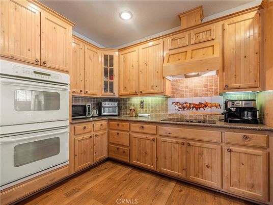 Interior, Kitchen, Recessed Lighting, Tile Countertops, Wood Texture Flooring