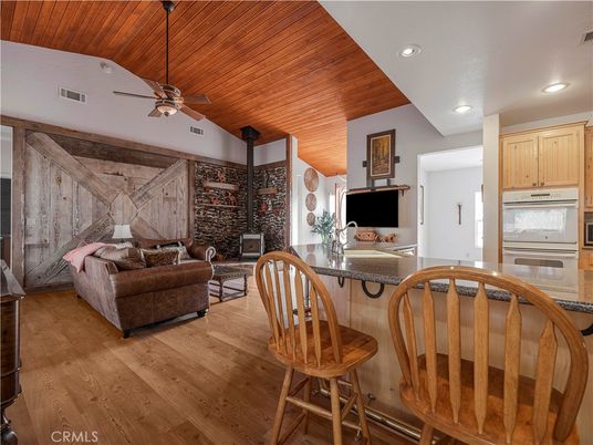 Dining room, Fireplace, Interior, Kitchen, Living room, Recessed Lighting, Stone Walls, Wooden Ceilings, Wood Texture Flooring