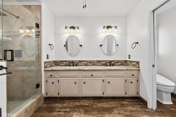 Bathroom, Dual Sink Vanities, Glass Shower, Interior, Wood Texture Flooring