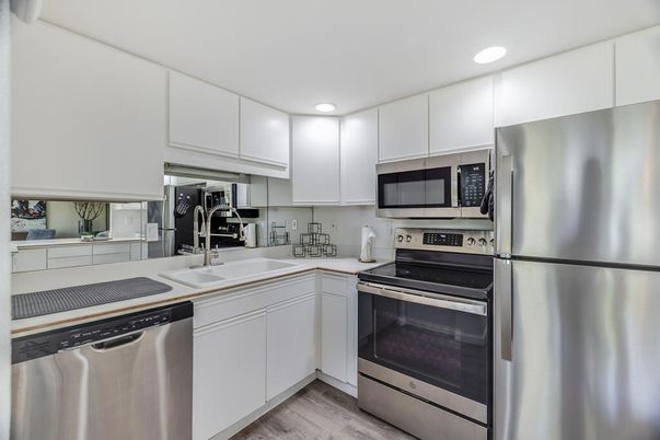 Interior, Kitchen, Recessed Lighting, Stainless Steel Appliances, Wood Texture Flooring