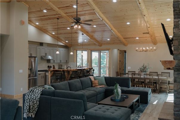 Chandelier, Dining room, Interior, Kitchen, Living room, Pendant Lights, Recessed Lighting, Stainless Steel Appliances, Wooden Beams, Wooden Ceilings, Wood Texture Flooring