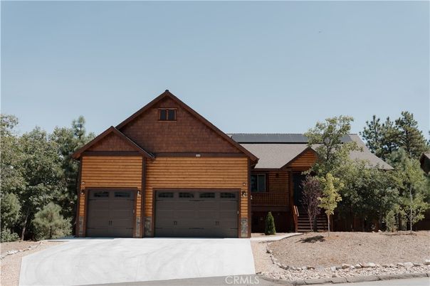 Attached, Exterior, Facade, Solar Panels, Log Home