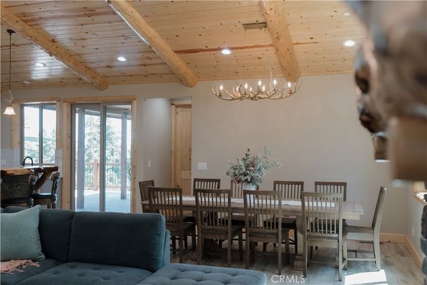 Chandelier, Dining room, Interior, Living room, Recessed Lighting, Wooden Beams, Wooden Ceilings, Wood Texture Flooring
