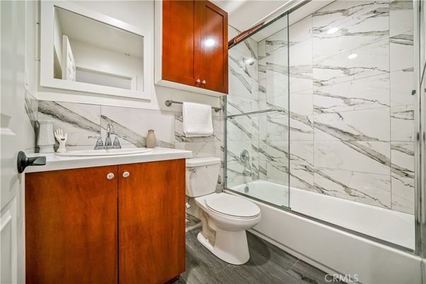 Bathroom, Glass Shower, Interior, Marble Walls, Wood Texture Flooring