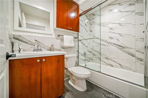 Bathroom, Glass Shower, Interior, Marble Walls, Wood Texture Flooring