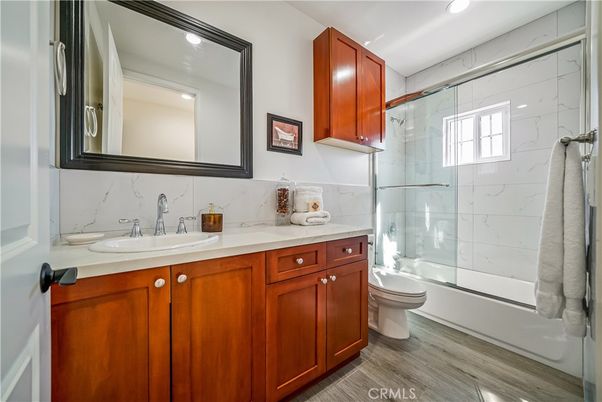 Bathroom, Glass Shower, Interior, Marble Walls, Recessed Lighting, Wood Texture Flooring