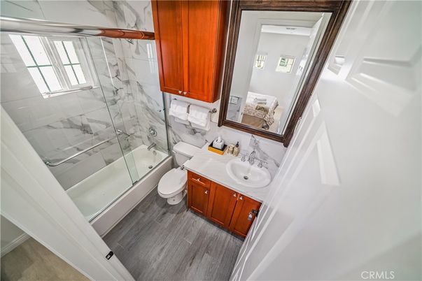 Bathroom, Glass Shower, Interior, Marble Walls, Wood Texture Flooring