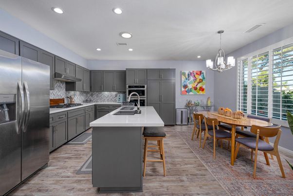 Dining room, Interior, Kitchen, Pendant Lights, Recessed Lighting, Stainless Steel Appliances, Wood Texture Flooring