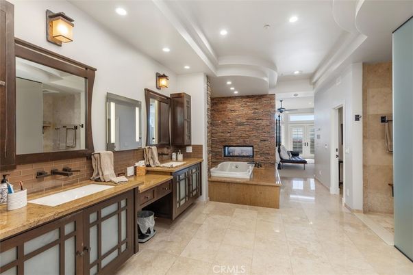 Bathroom, Dual Sink Vanities, Fireplace, Interior, Recessed Lighting, Stone Walls