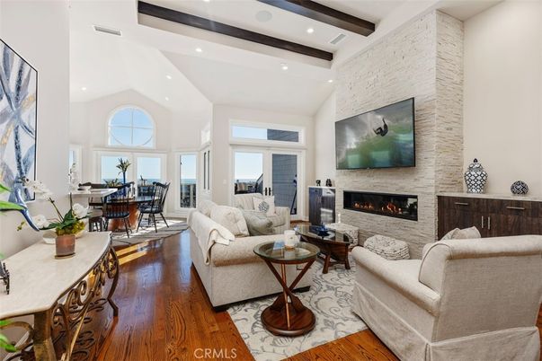 Dining room, Fireplace, Interior, Living room, Recessed Lighting, Stone Walls, Wooden Beams, Wood Texture Flooring
