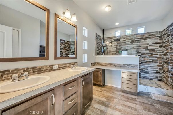 Bathroom, Dual Sink Vanities, Interior, Marble, Recessed Lighting, Wood Texture Flooring