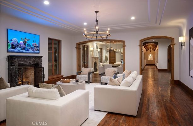 Chandelier, Dining room, Fireplace, Interior, Living room, Pendant Lights, Recessed Lighting, Wood Texture Flooring
