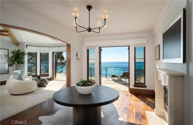 Chandelier, Fireplace, Interior, Living room, Recessed Lighting, Water, Wood Texture Flooring