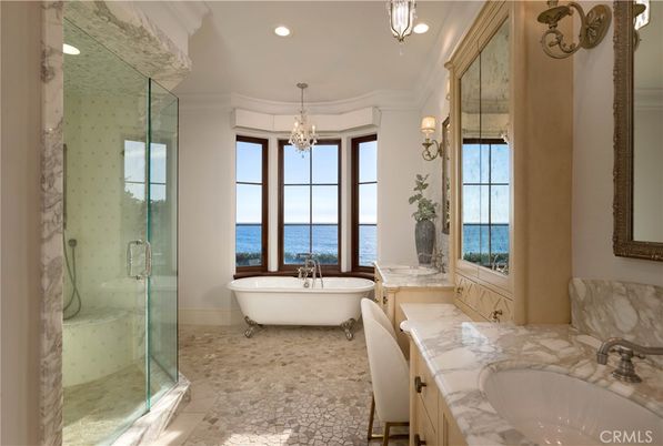 Bathroom, Chandelier, Free Standing Baths, Glass Shower, Interior, Marble Walls, Recessed Lighting, Water