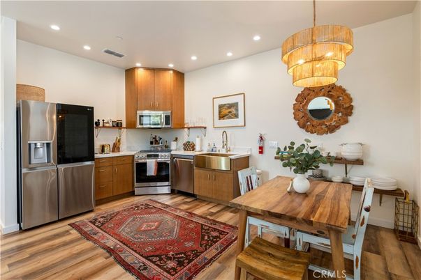 Chandelier, Dining room, Interior, Kitchen, Recessed Lighting, Stainless Steel Appliances, Wood Texture Flooring