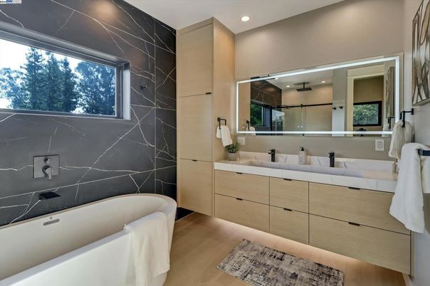 Bathroom, Dual Sink Vanities, Free Standing Baths, Interior, Marble Walls, Recessed Lighting, Wood Texture Flooring
