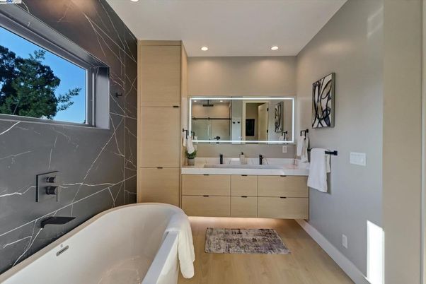 Bathroom, Dual Sink Vanities, Free Standing Baths, Interior, Marble Walls, Recessed Lighting, Wood Texture Flooring