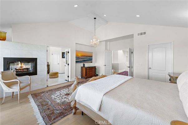 Bedroom, Chandelier, Fireplace, Interior, Recessed Lighting, Wood Texture Flooring