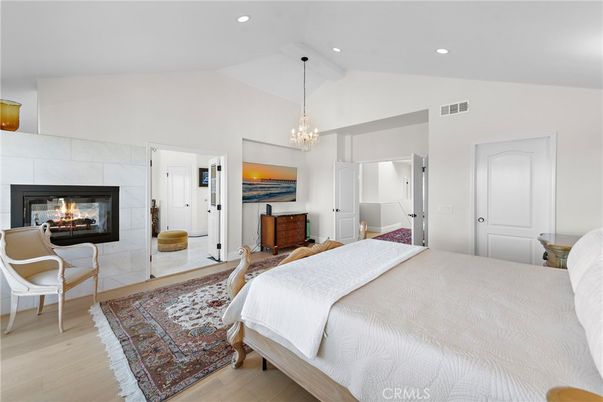 Bedroom, Chandelier, Fireplace, Interior, Pendant Lights, Recessed Lighting, Wood Texture Flooring
