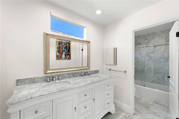 Bathroom, Dual Sink Vanities, Glass Shower, Interior, Marble, Marble Walls, Recessed Lighting