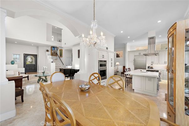 Chandelier, Dining room, Interior, Kitchen, Living room, Pendant Lights, Piano, Recessed Lighting, Stainless Steel Appliances
