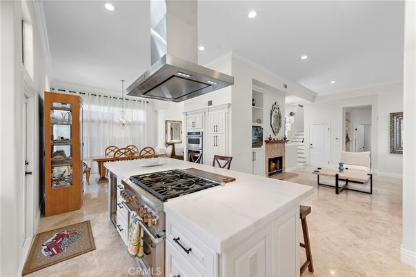 Chandelier, Dining room, Fireplace, Interior, Kitchen, Pendant Lights, Recessed Lighting, Stainless Steel Appliances