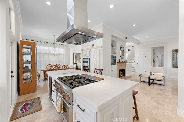 Chandelier, Dining room, Fireplace, Interior, Kitchen, Pendant Lights, Recessed Lighting, Stainless Steel Appliances
