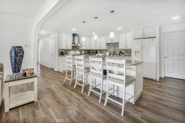 Dining room, Interior, Kitchen, Pendant Lights, Recessed Lighting, Stainless Steel Appliances, Wood Texture Flooring