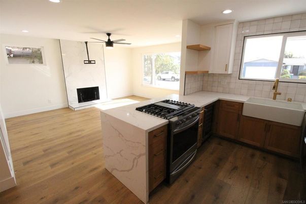 Fireplace, Interior, Kitchen, Marble Walls, Recessed Lighting, Wood Texture Flooring