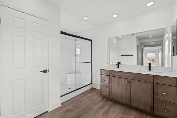 Bathroom, Dual Sink Vanities, Glass Shower, Interior, Recessed Lighting, Wood Texture Flooring