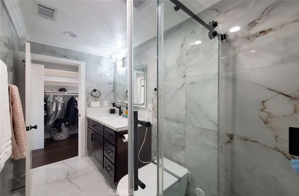Bathroom, Glass Shower, Interior, Marble, Marble Walls, Recessed Lighting, Walk-in Closets, Wood Texture Flooring