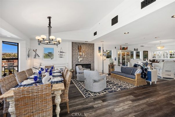 Chandelier, Dining room, Fireplace, Interior, Living room, Pendant Lights, Recessed Lighting, Wood Texture Flooring